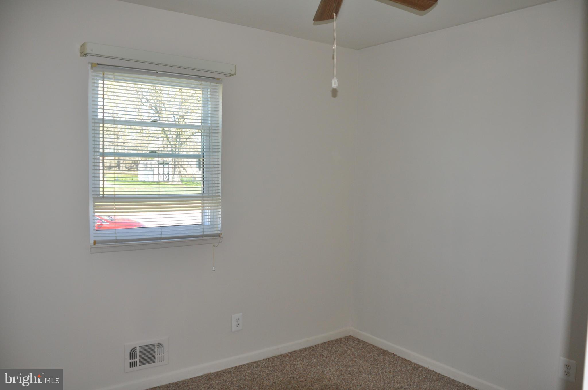 3837 Bayville Road Baltimore, MD 21220 - Photo 10 of 14 an empty room with a window