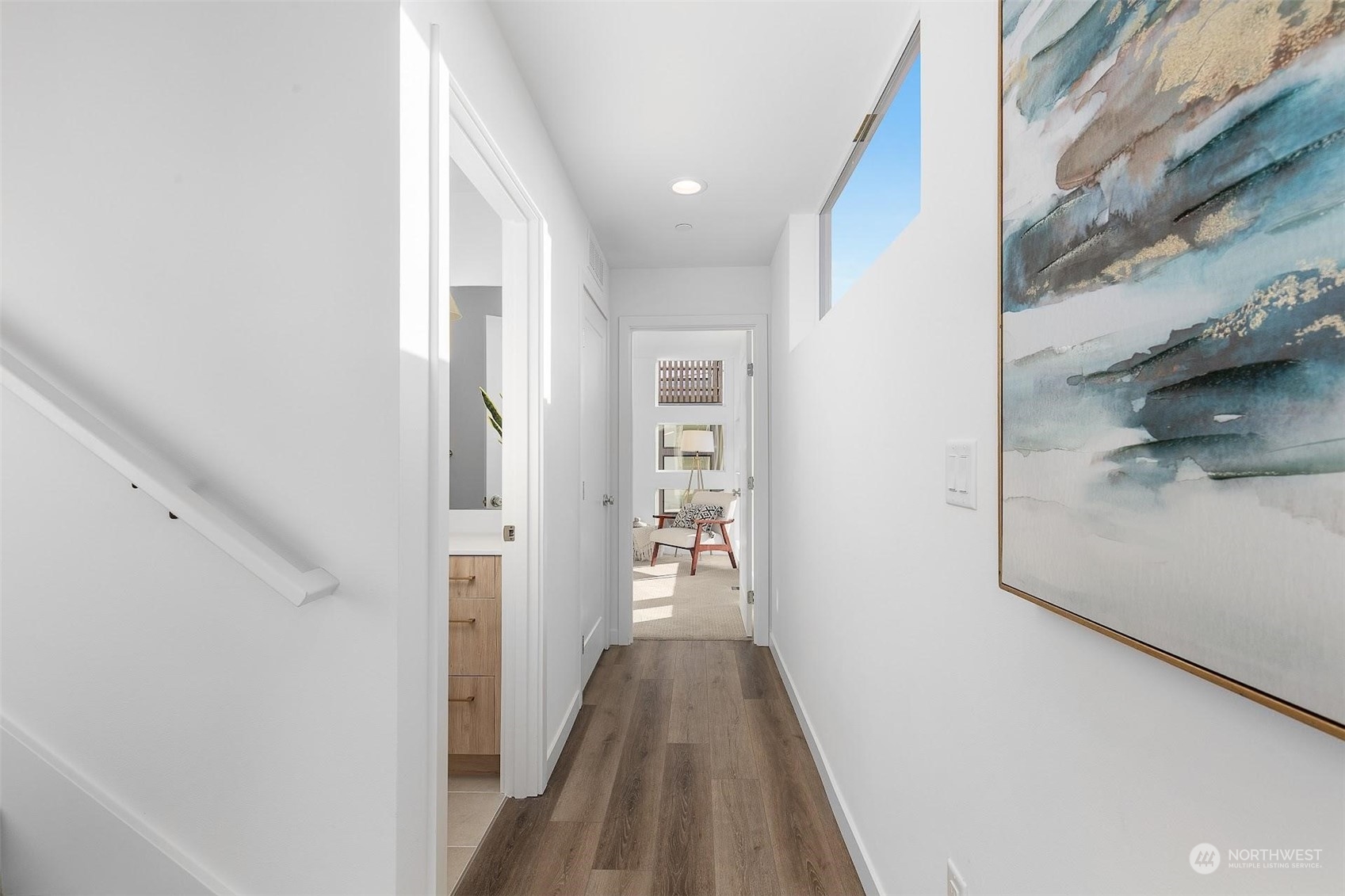 930 Northwest 56th Street Seattle, WA 98107 - Photo 16 of 35 a view of a hallway with wooden floor and staircase