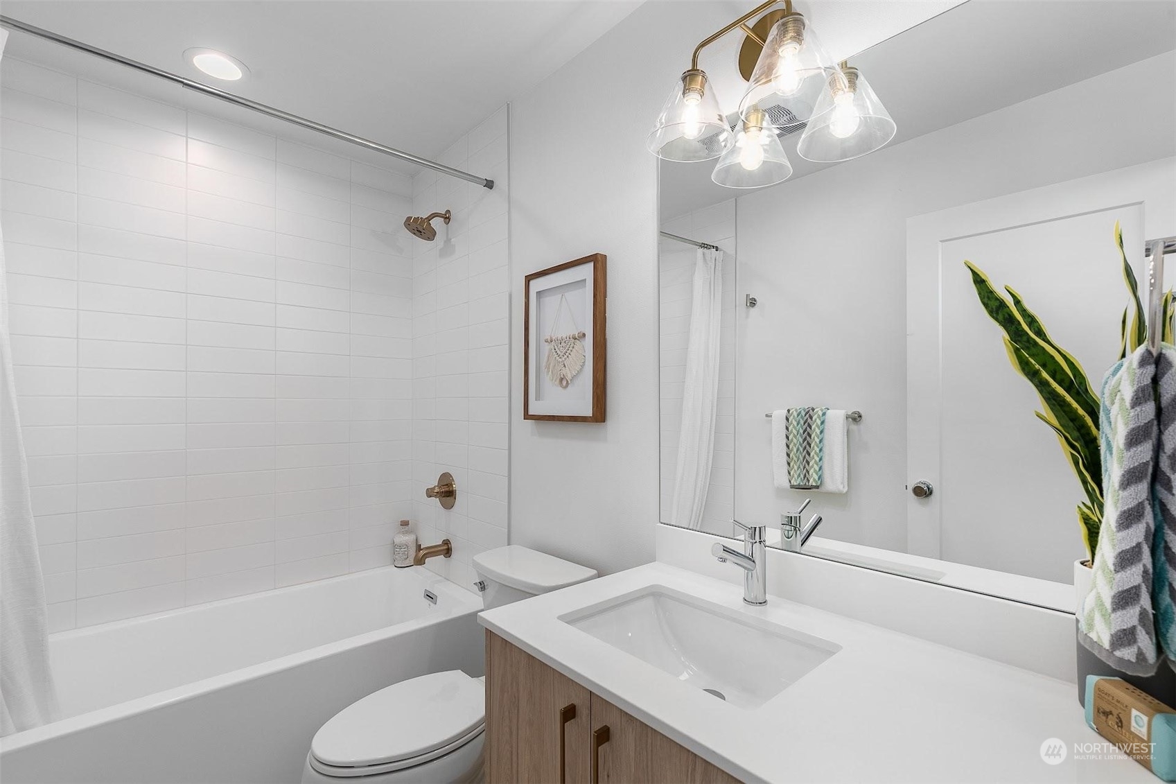 930 Northwest 56th Street Seattle, WA 98107 - Photo 17 of 35 a bathroom with a sink a toilet and bathtub