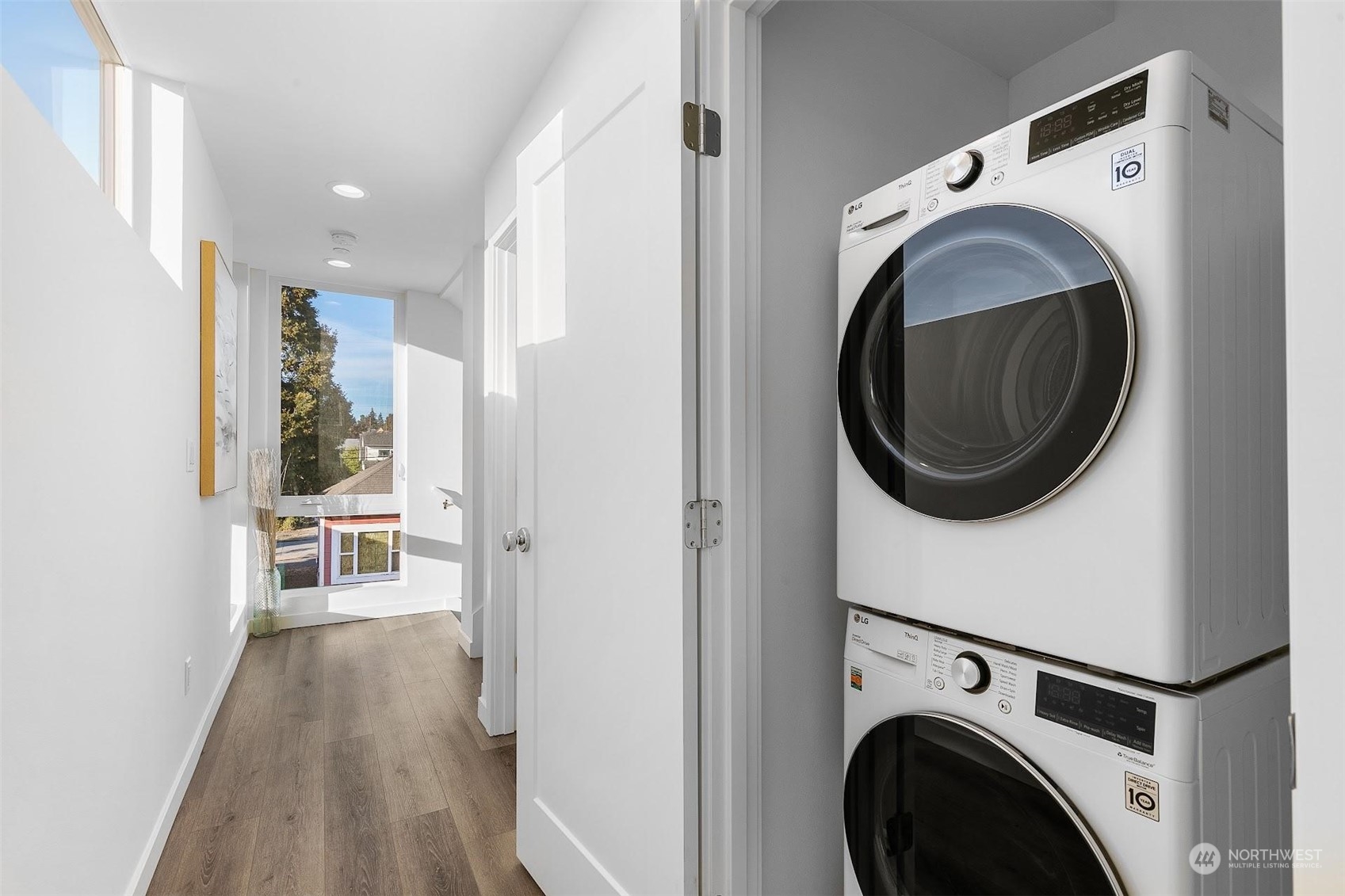 930 Northwest 56th Street Seattle, WA 98107 - Photo 20 of 35 a view of a hallway with washer and dryer