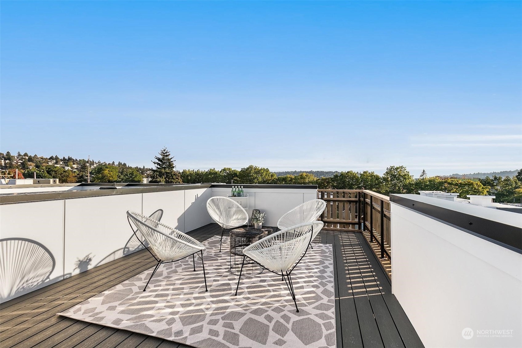 930 Northwest 56th Street Seattle, WA 98107 - Photo 21 of 35 a view of a roof deck with couches and sky view