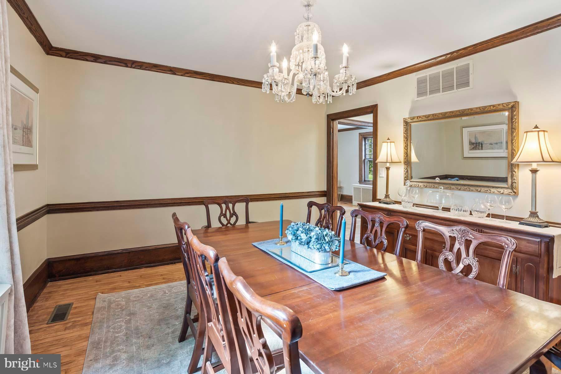 261 Forrest Road Merion Station, PA 19066 - Photo 15 of 43 a view of a dining room with furniture a chandelier and wooden floor