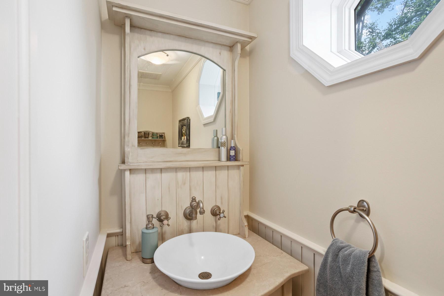 261 Forrest Road Merion Station, PA 19066 - Photo 16 of 43 a bathroom with a toilet a sink and mirror