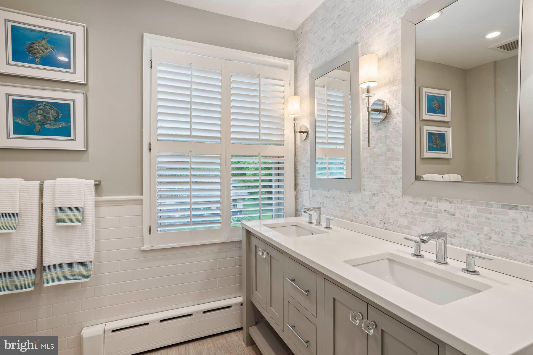 261 Forrest Road Merion Station, PA 19066 - Photo 24 of 43 a bathroom with a sink double vanity and a shower