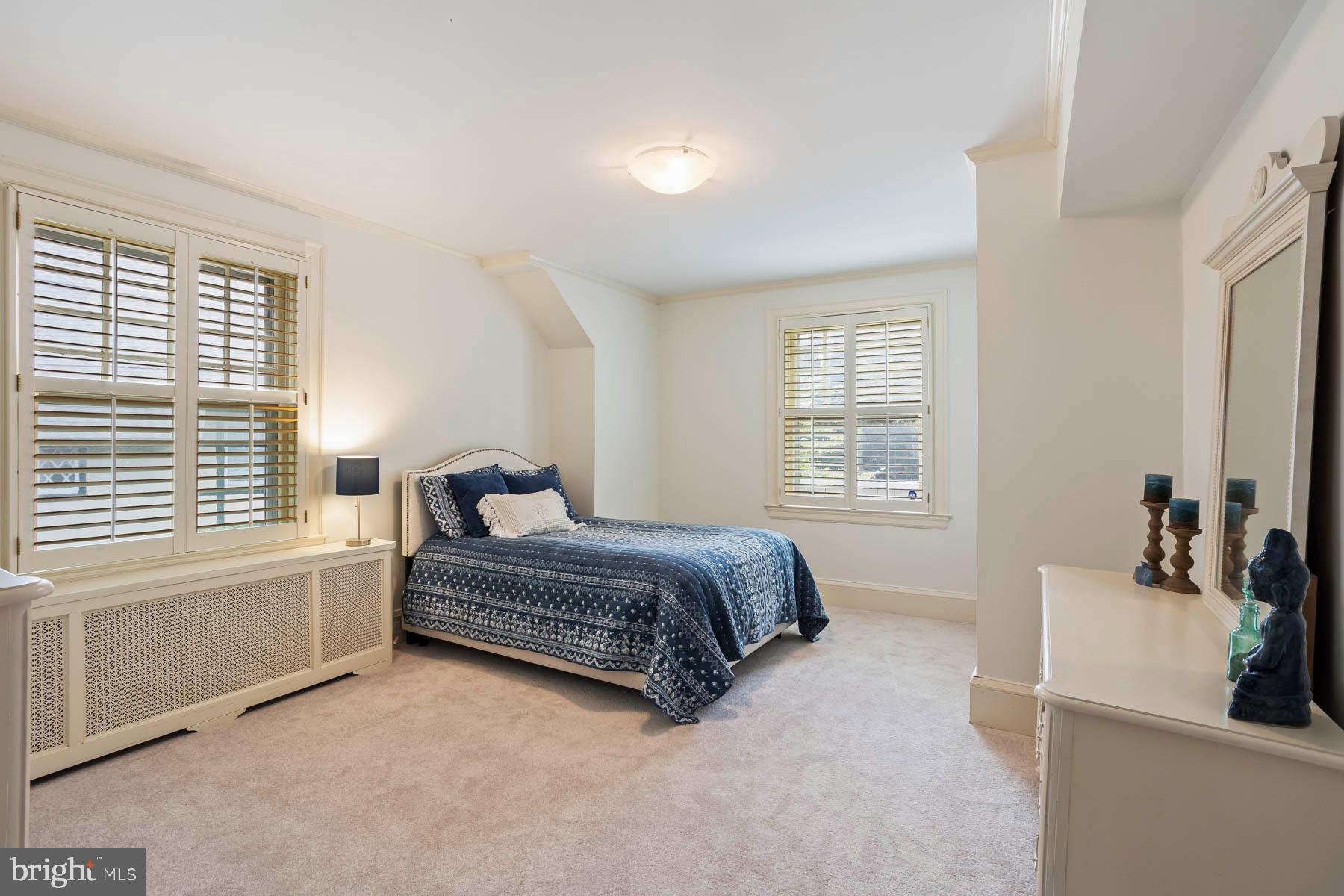 261 Forrest Road Merion Station, PA 19066 - Photo 26 of 43 a spacious bedroom with a bed and a window