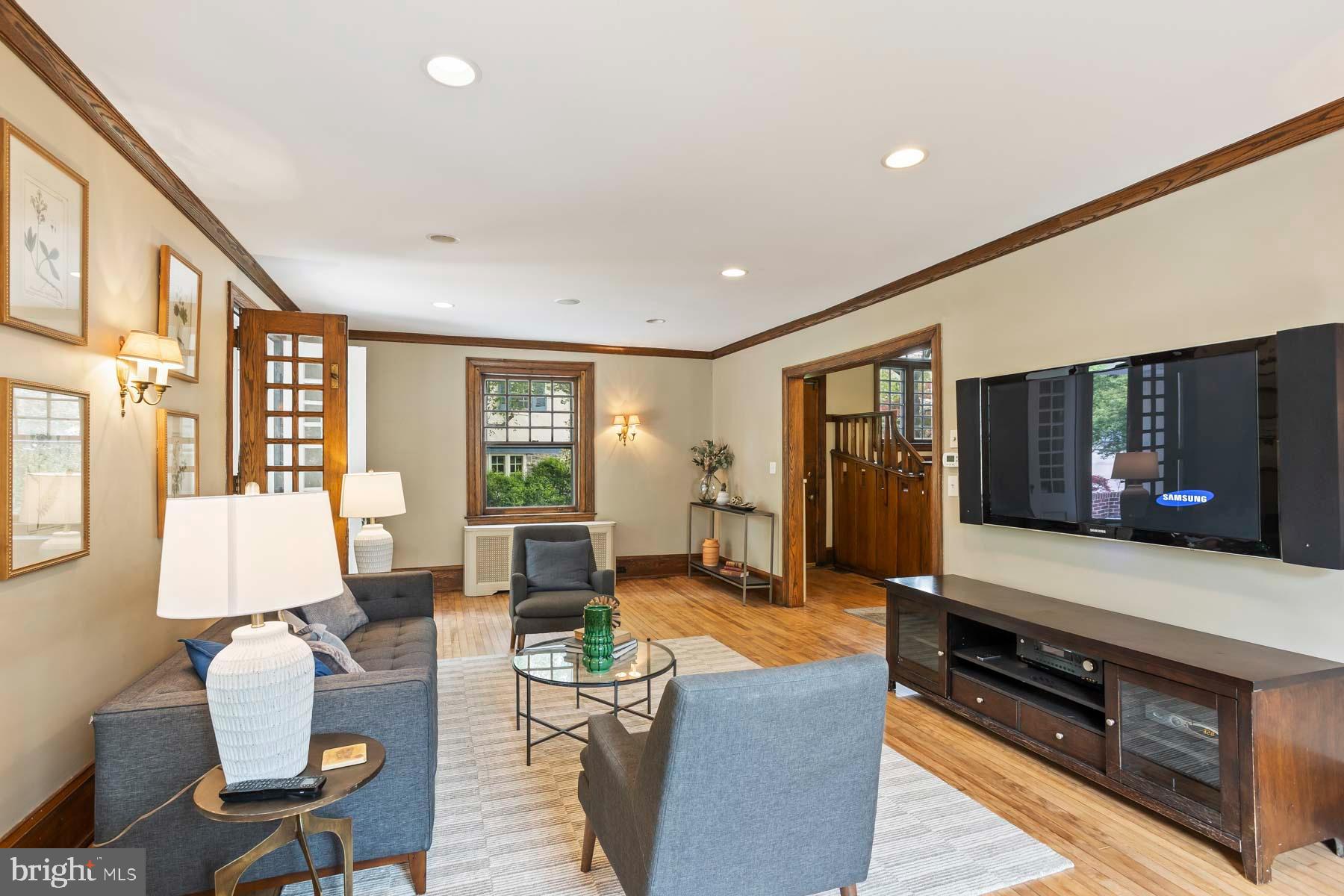 261 Forrest Road Merion Station, PA 19066 - Photo 6 of 43 a living room with furniture a wooden floor and large window