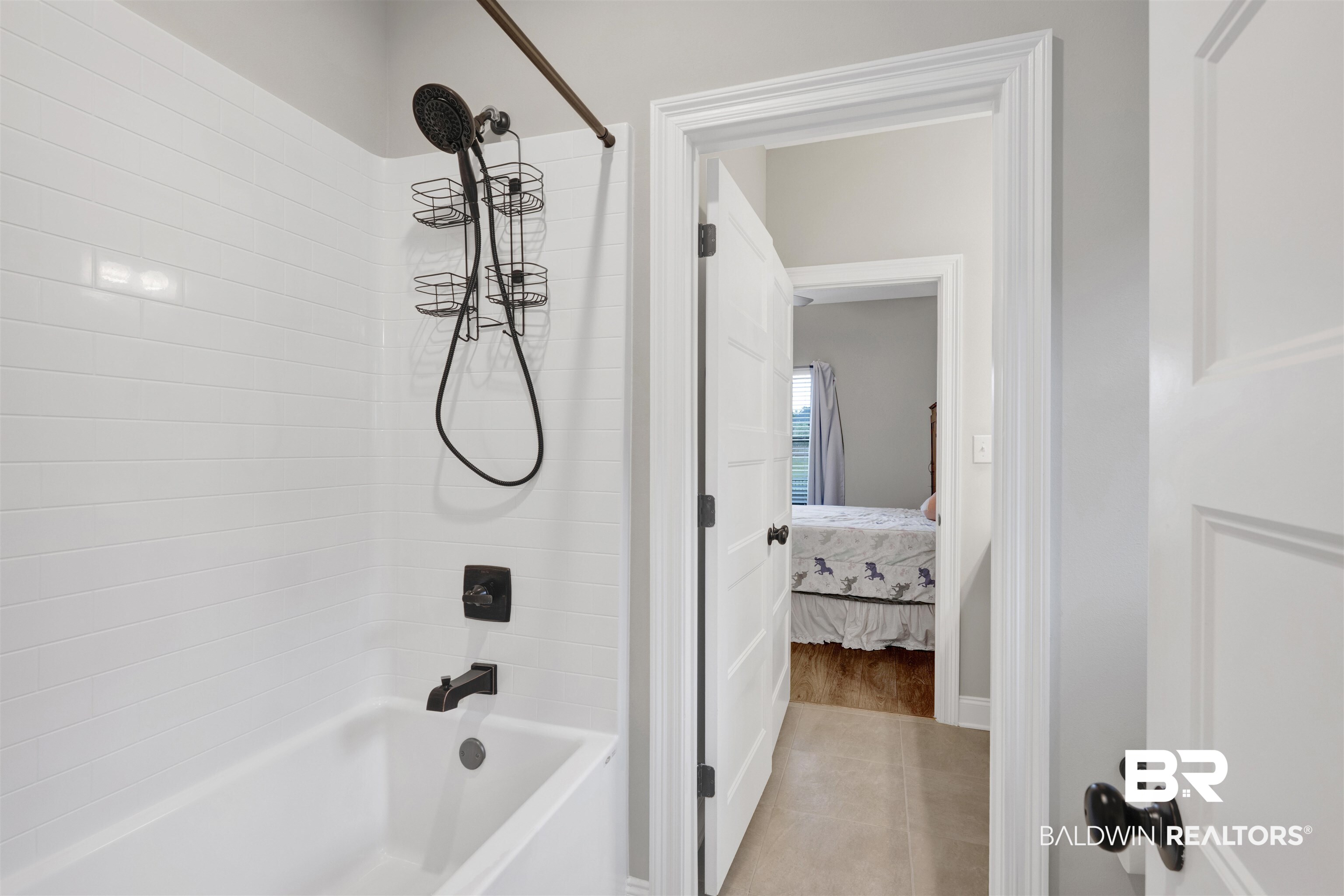 12672 Squirrel Drive Daphne, AL 36527 - Photo 31 of 49 Bathtub with white subway tile surround and matte black fixtures, including a rainfall showerhead