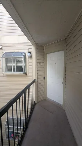 a view of a house with wooden deck