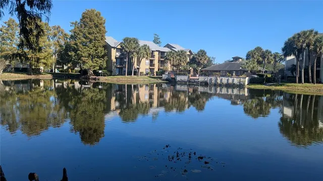 a living room with furniture gym equipment and a large window