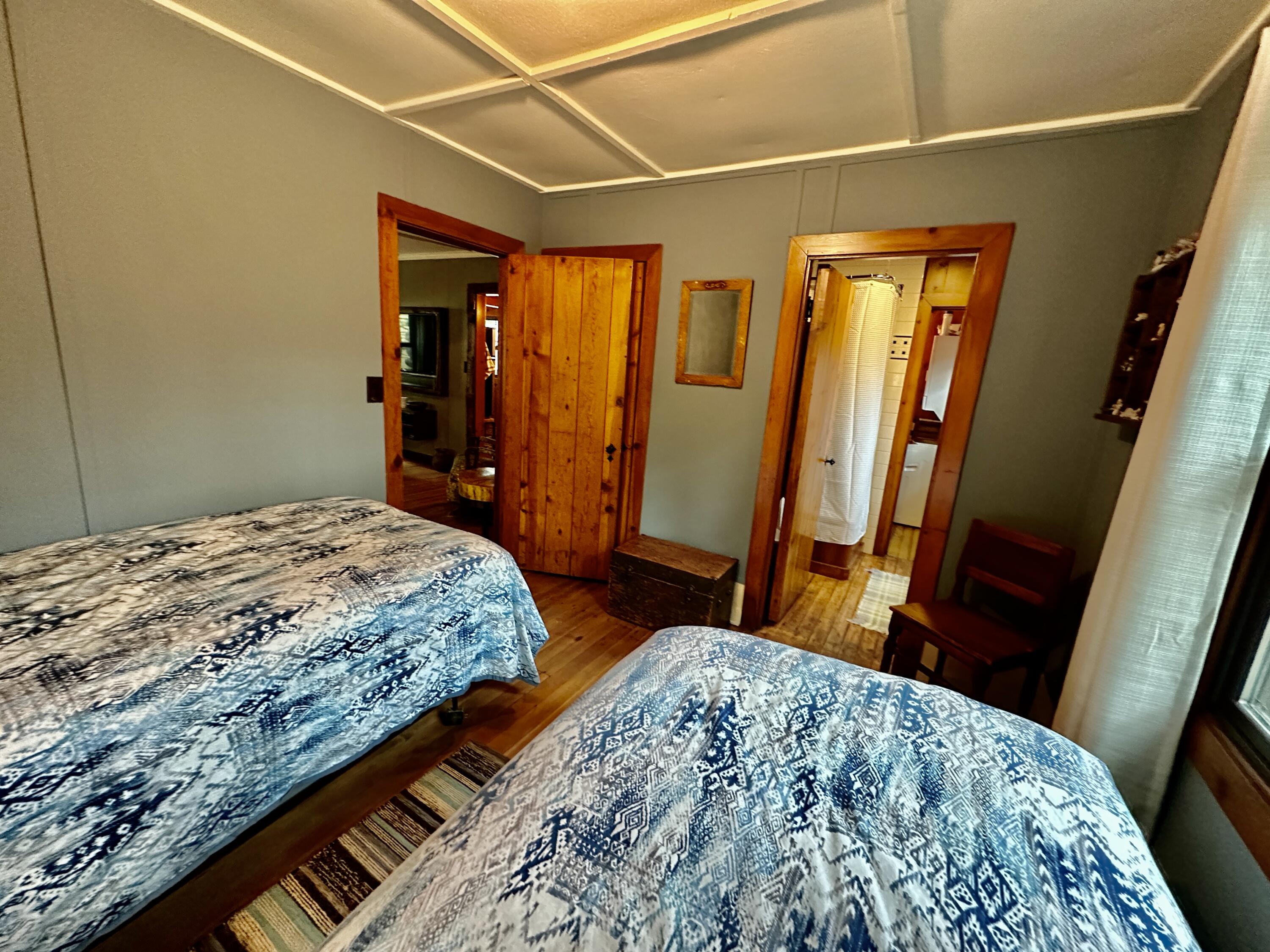 53765 Idyllwild Road Idyllwild, CA 92549 - Photo 41 of 43 a bedroom with a bed and a mirror