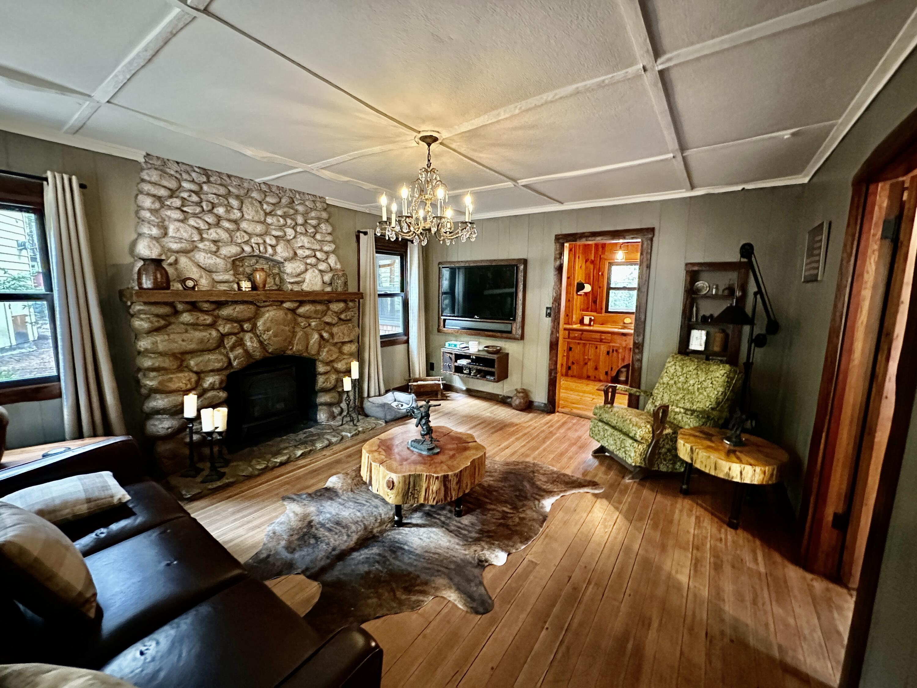 53765 Idyllwild Road Idyllwild, CA 92549 - Photo 6 of 43 a living room with furniture and a fireplace