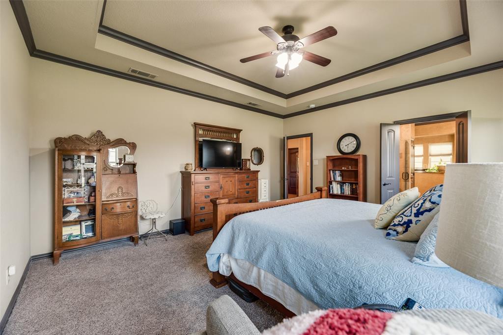 1132 Chartres Street Kaufman, TX 75142 - Photo 12 of 25 Carpeted room featuring a tray ceiling with dark trim, a ceiling fan, and recessed lighting