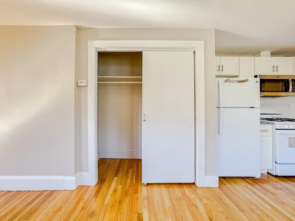 a view of kitchen and wooden floor