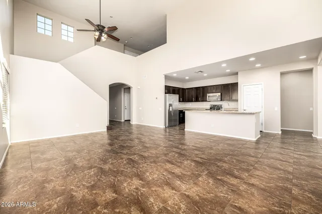 a kitchen with stainless steel appliances a refrigerator and a stove top oven