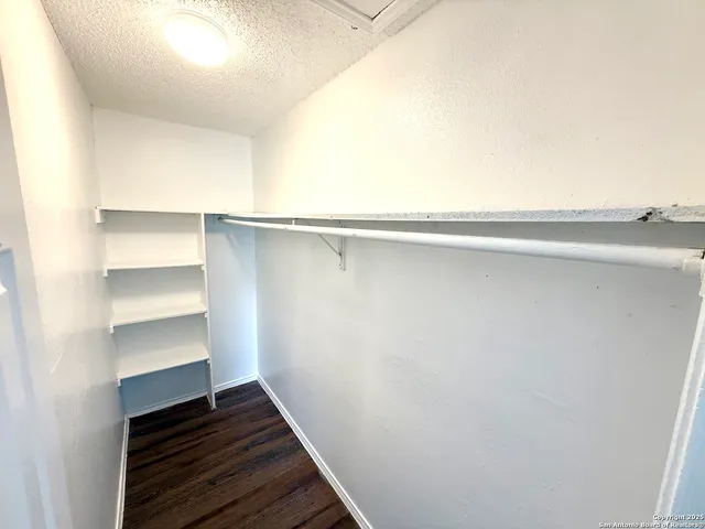 a bathroom with a bathtub and toilet