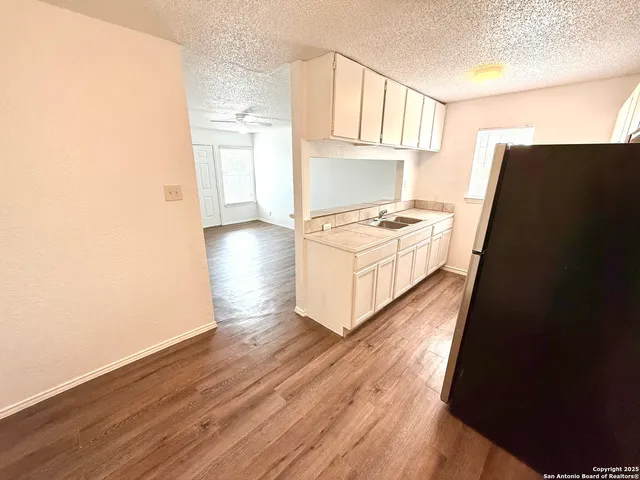 a white refrigerator freezer sitting inside of a kitchen