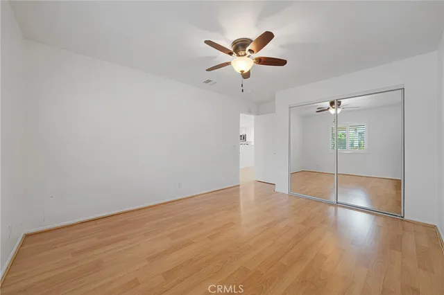 a bathroom with a double vanity sink toilet mirror and bathtub