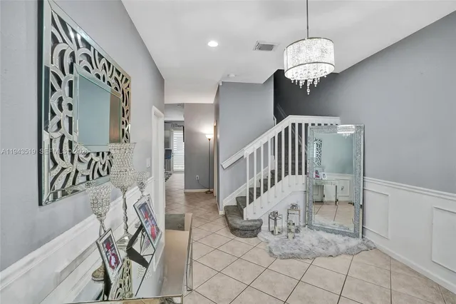 a view of entryway hall with a front door