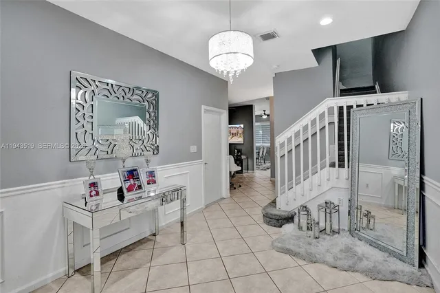 a view of entryway with kitchen