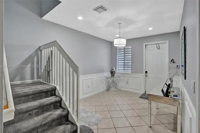 a view of an entryway with a workspace