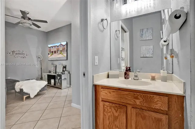 a en suite bathroom with a sink double vanity and a mirror