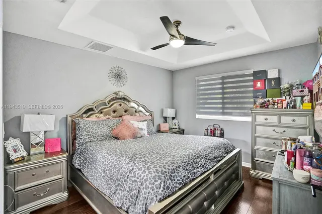 a bedroom with a bed and dresser