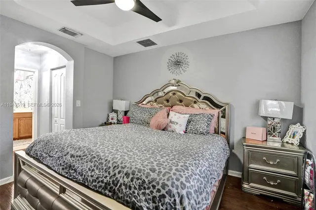 a bedroom with a bed and dresser