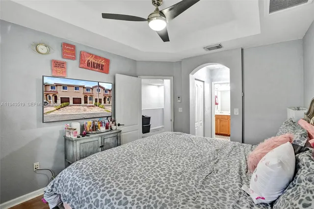 a bedroom with a bed and dresser