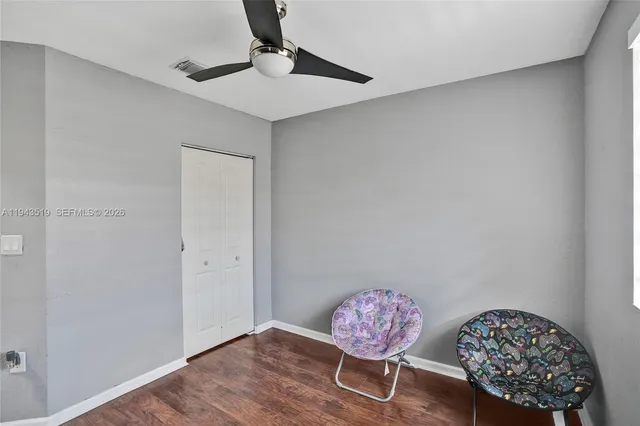 a view of a room with a table and a chair