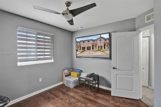 a bed room with furniture and a window