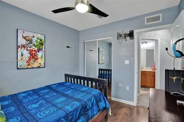 a bedroom with a bed and a view of livingroom