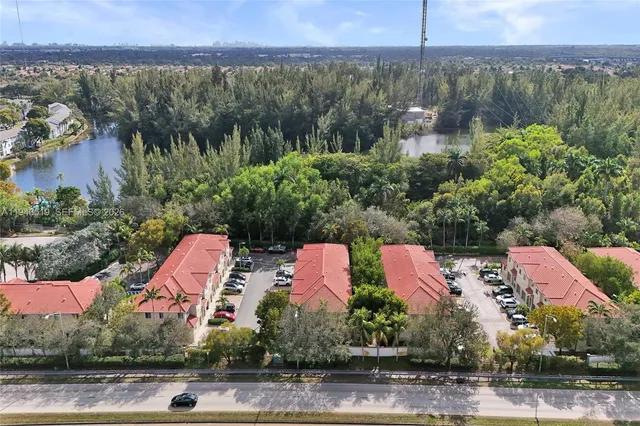 an aerial view of a house with a garden and a yard