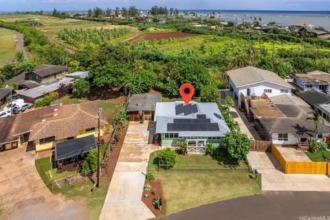 an aerial view of a house with a garden