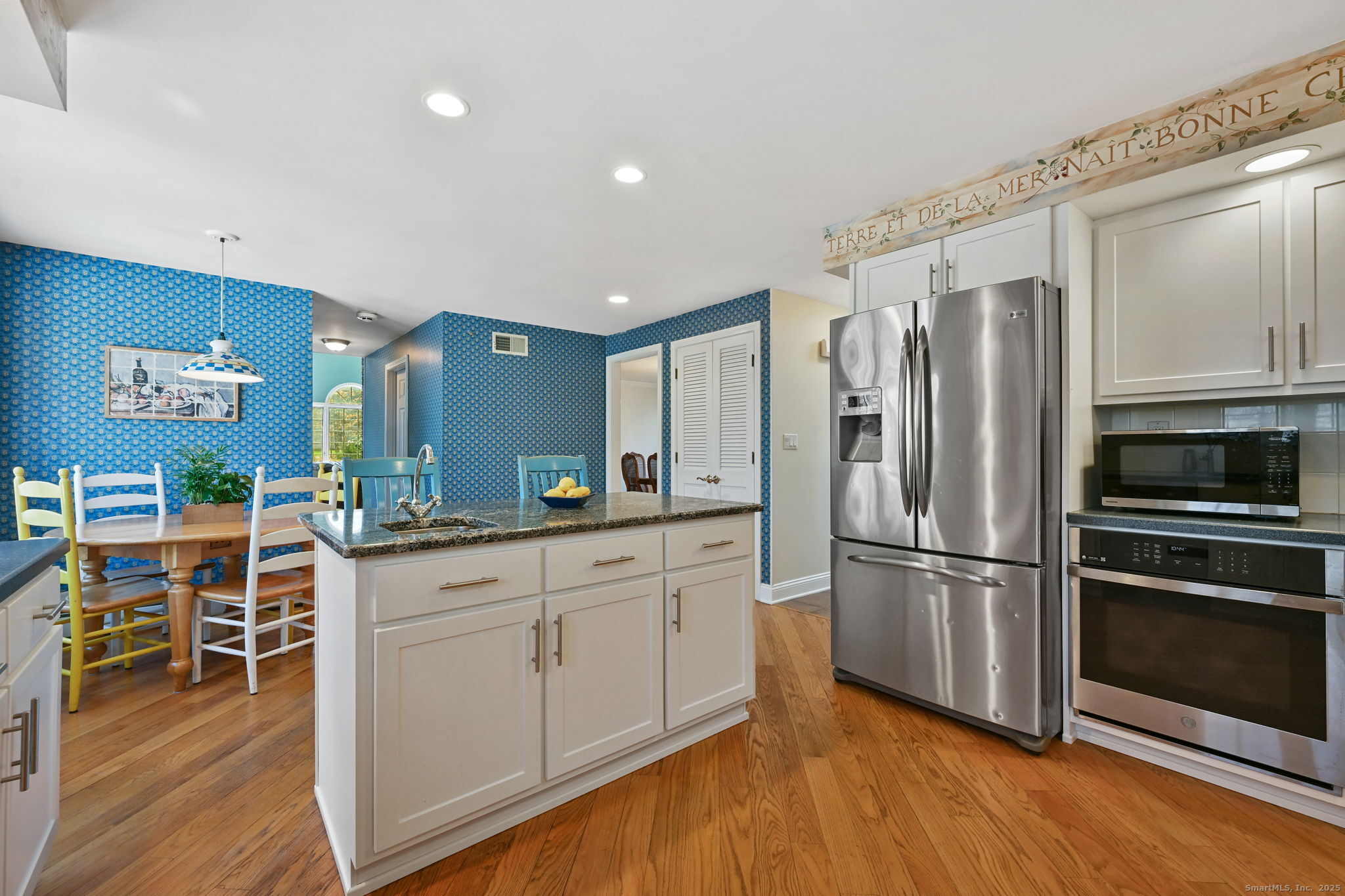 269 Thunder Lake Road Wilton, CT 06897 - Photo 11 of 26 a kitchen with stainless steel appliances granite countertop a refrigerator and a stove top oven