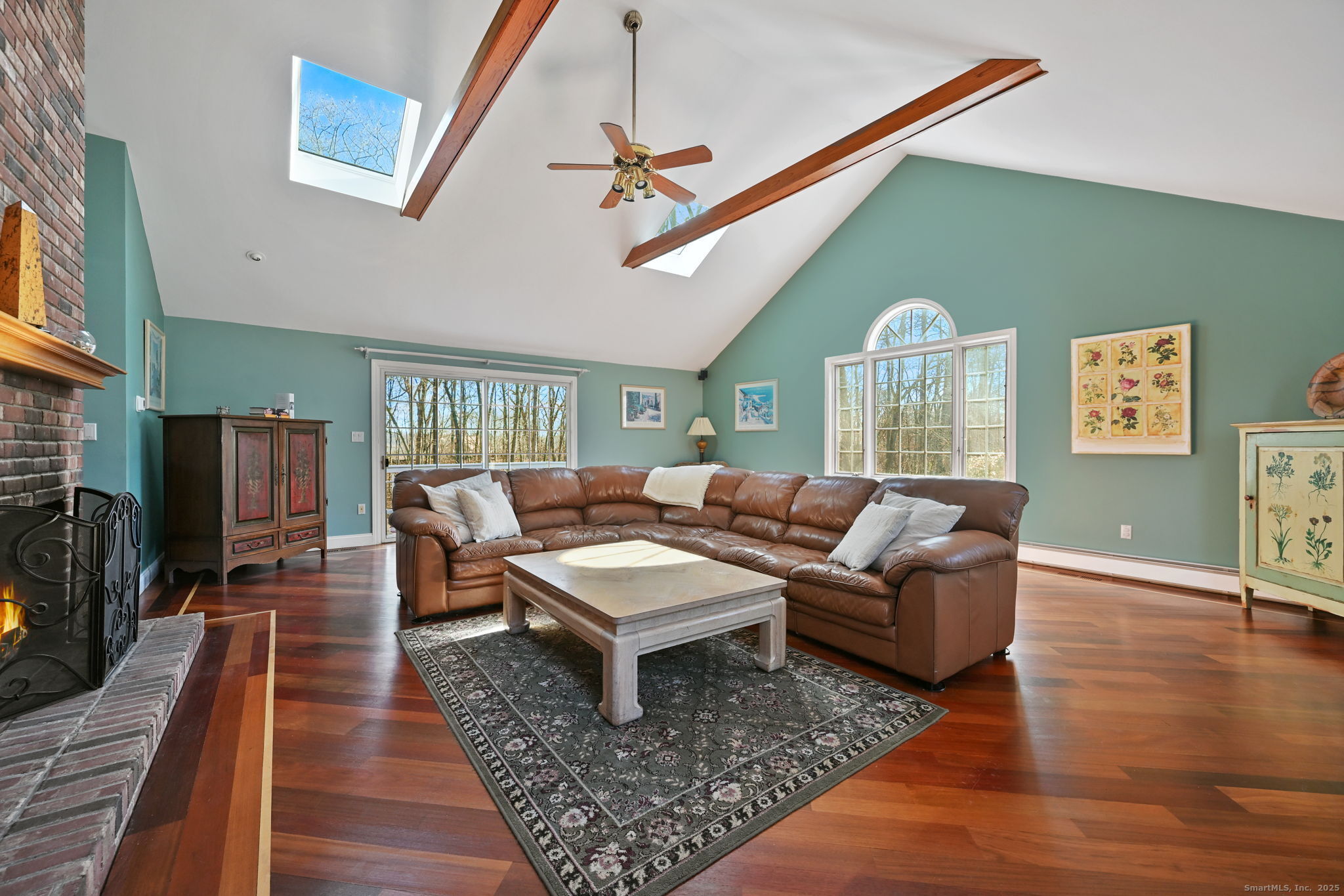 269 Thunder Lake Road Wilton, CT 06897 - Photo 12 of 26 a living room with furniture and a rug