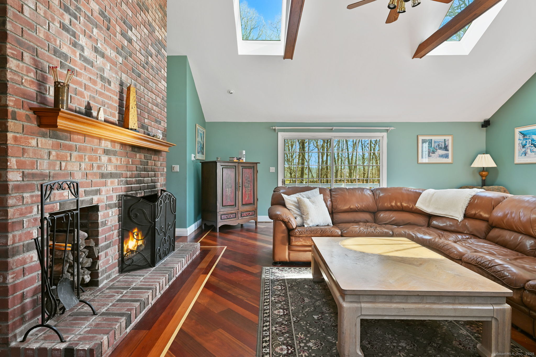 269 Thunder Lake Road Wilton, CT 06897 - Photo 13 of 26 a living room with furniture and a fireplace