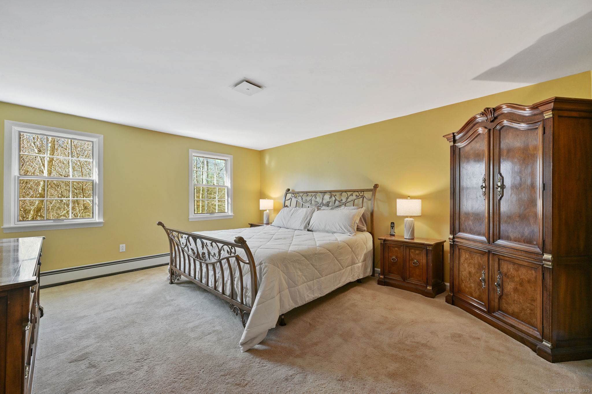 269 Thunder Lake Road Wilton, CT 06897 - Photo 14 of 26 a bedroom with a bed and a window