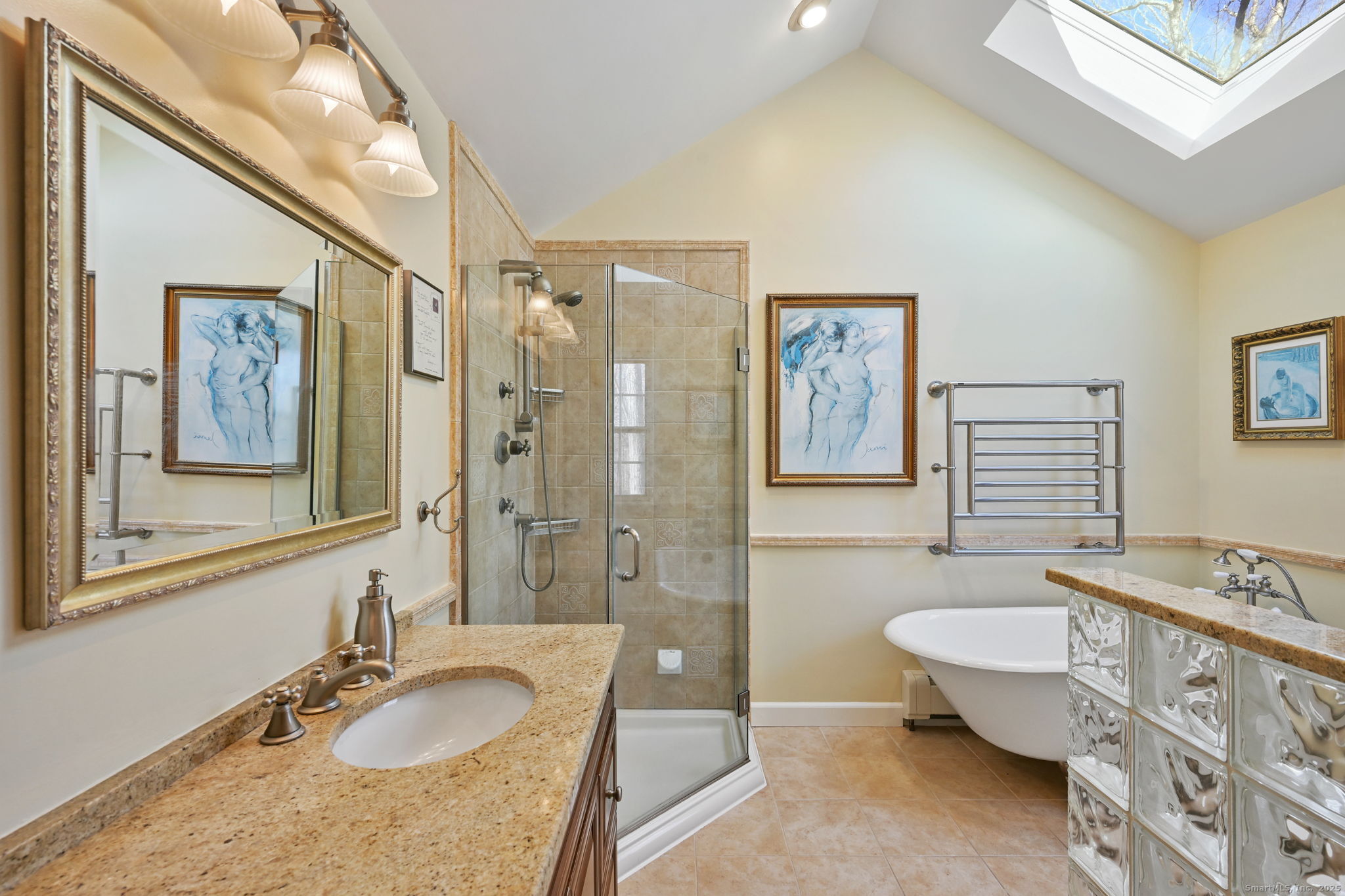 269 Thunder Lake Road Wilton, CT 06897 - Photo 15 of 26 a bathroom with a granite countertop sink and a mirror