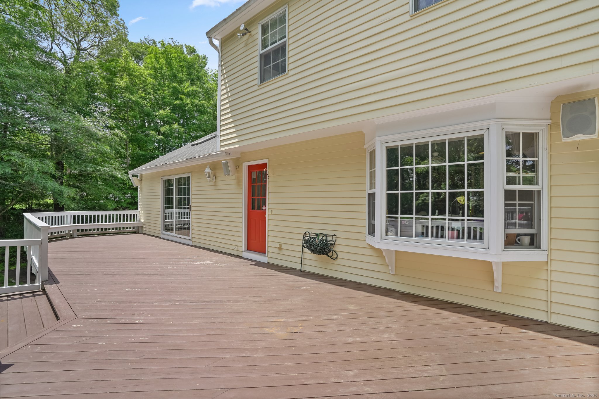 269 Thunder Lake Road Wilton, CT 06897 - Photo 19 of 26 a view of house with backyard and glass windows