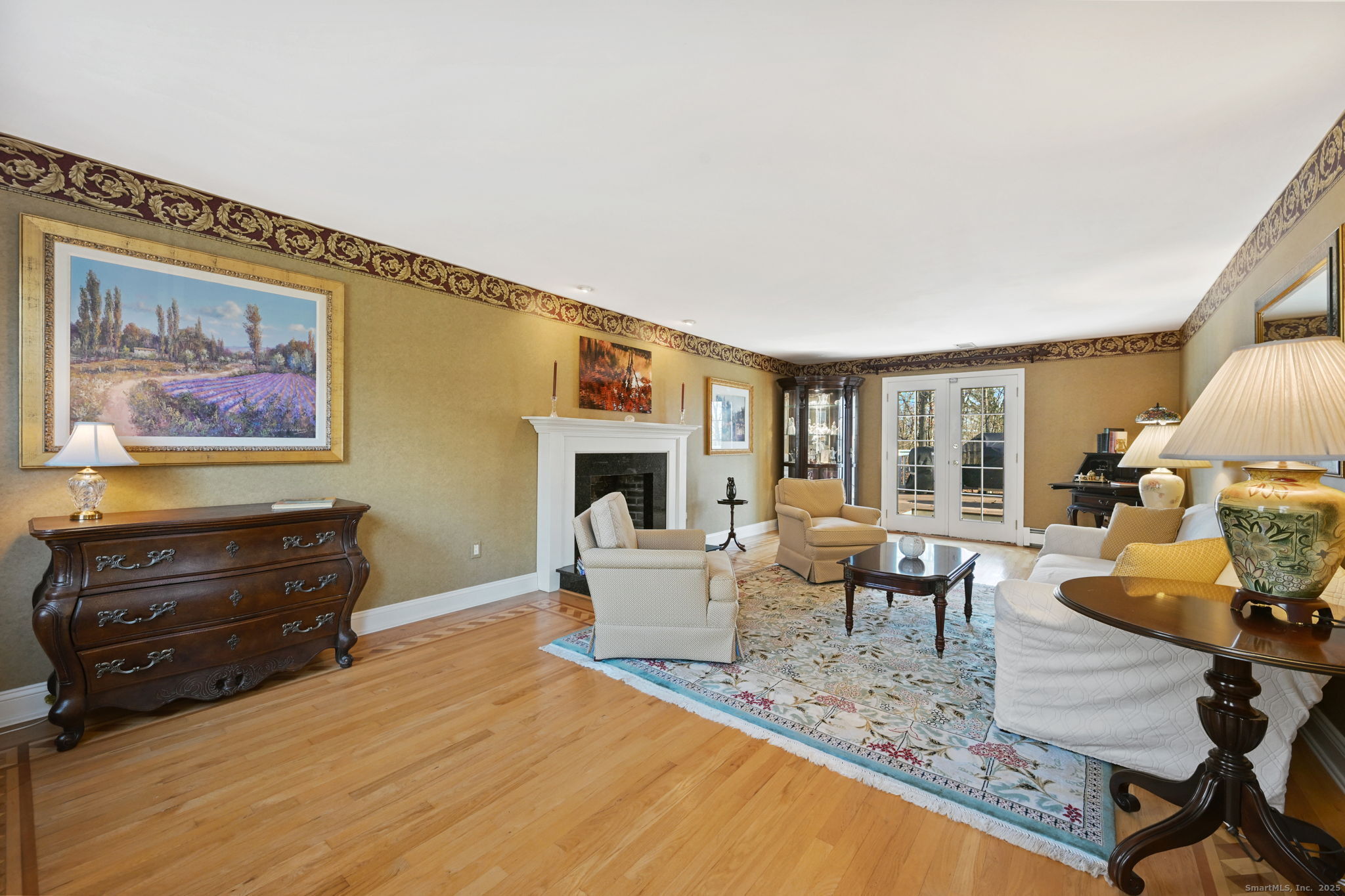 269 Thunder Lake Road Wilton, CT 06897 - Photo 4 of 26 a living room with furniture and a flat screen tv