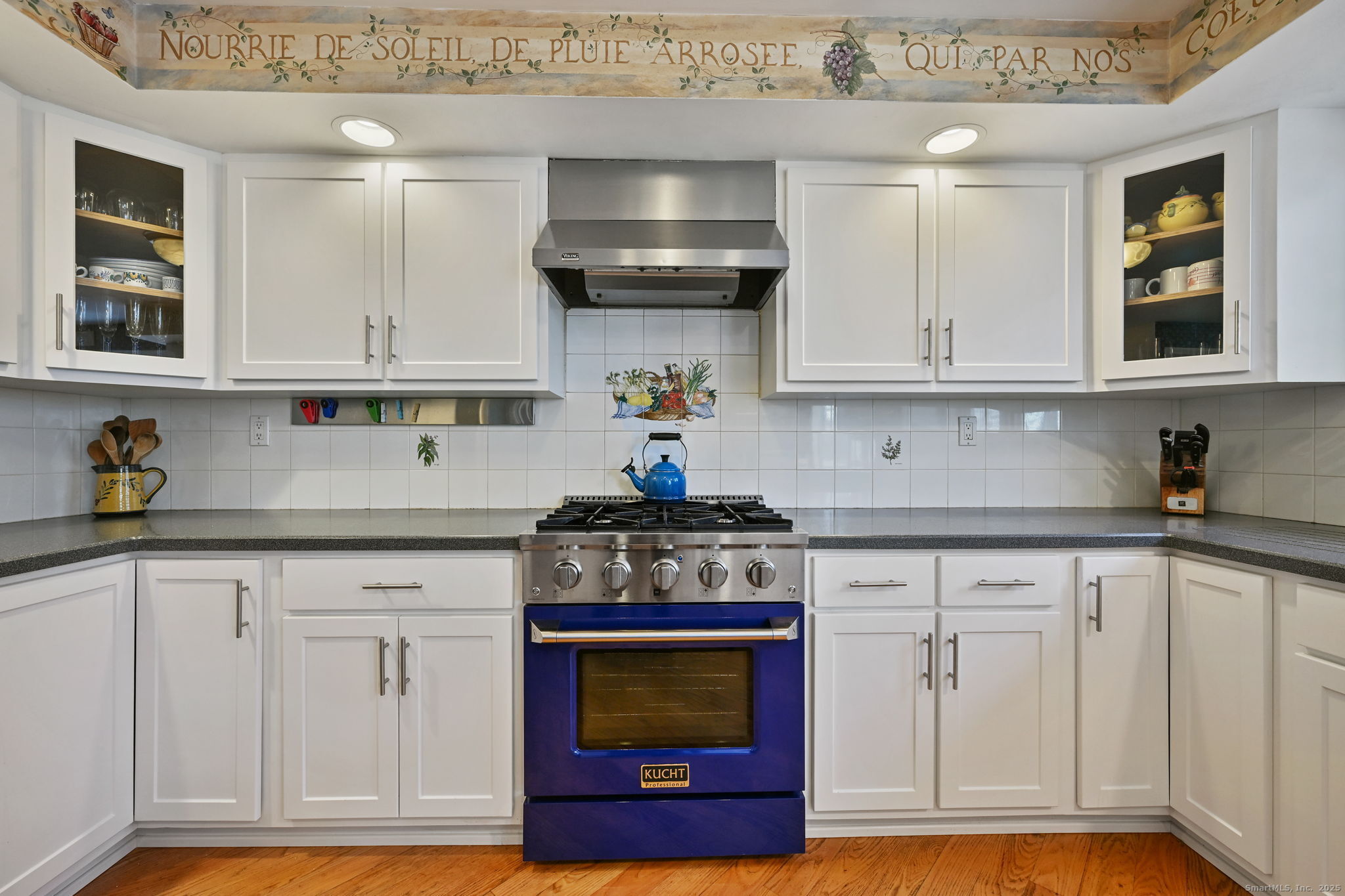 269 Thunder Lake Road Wilton, CT 06897 - Photo 7 of 26 a kitchen with white cabinets and appliances