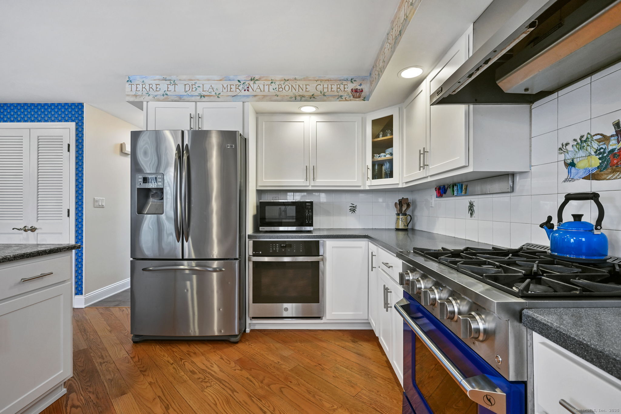 269 Thunder Lake Road Wilton, CT 06897 - Photo 10 of 26 a kitchen with stainless steel appliances granite countertop a refrigerator and a stove top oven