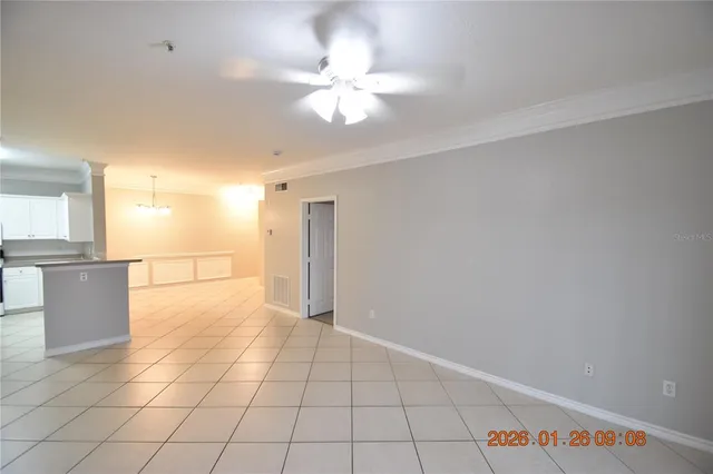 a view of a kitchen with a sink and a refrigerator