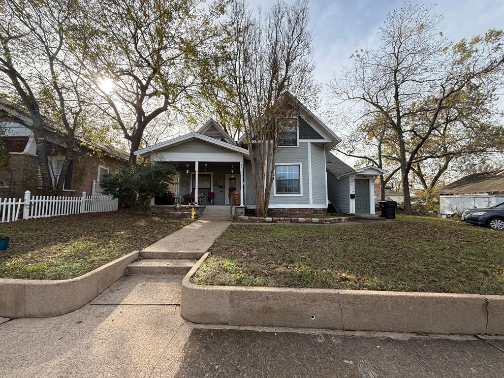 224 West Hull Street, Unit B Denison, TX 75020 - Photo 1 of 13 a front view of a house with a yard