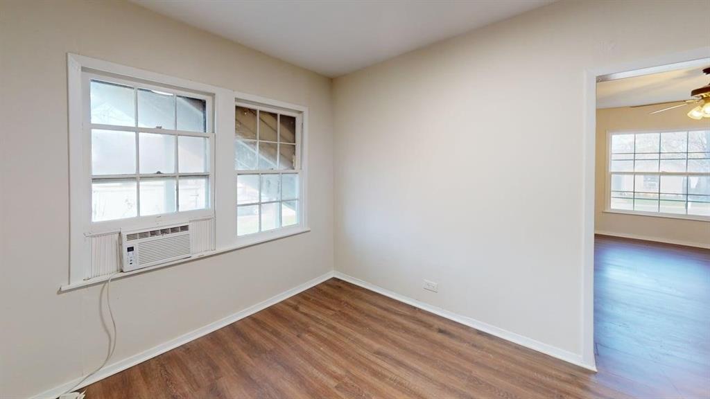 224 West Hull Street, Unit B Denison, TX 75020 - Photo 4 of 13 a view of empty room with wooden floor and fan
