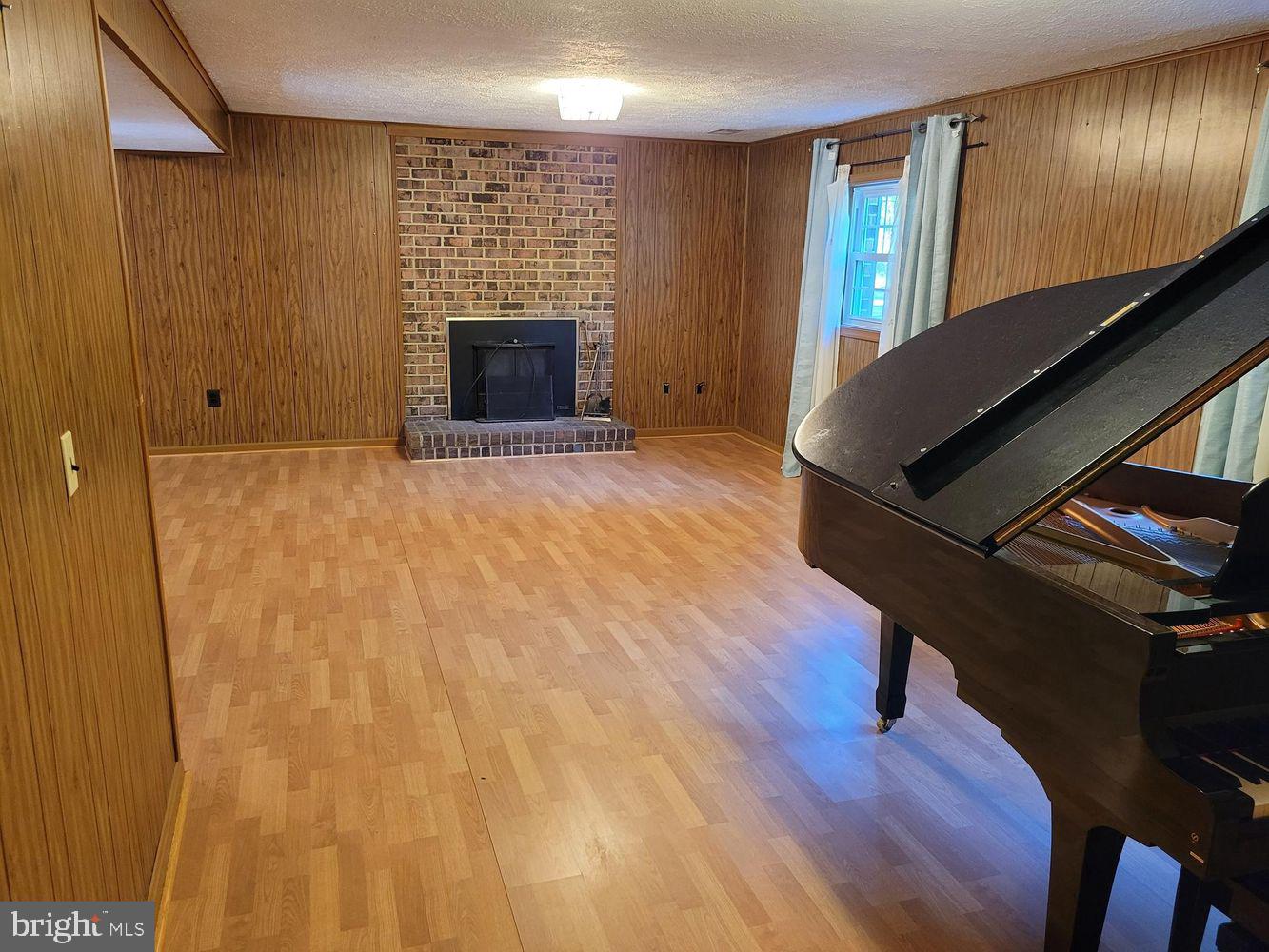 6684 Old Blacksmith Drive Burke, VA 22015 - Photo 15 of 26 a view of an empty room with wooden floor and a window