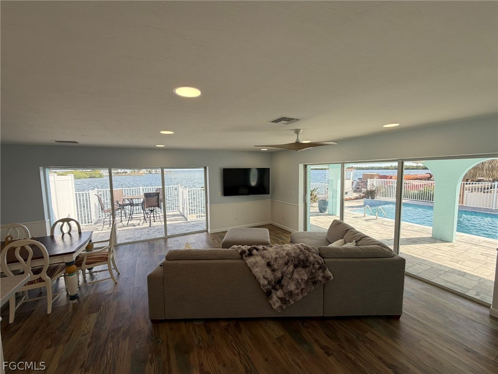 4743 Pine Island Road Matlacha, FL 33993 - Photo 15 of 34 a living room with furniture and a flat screen tv