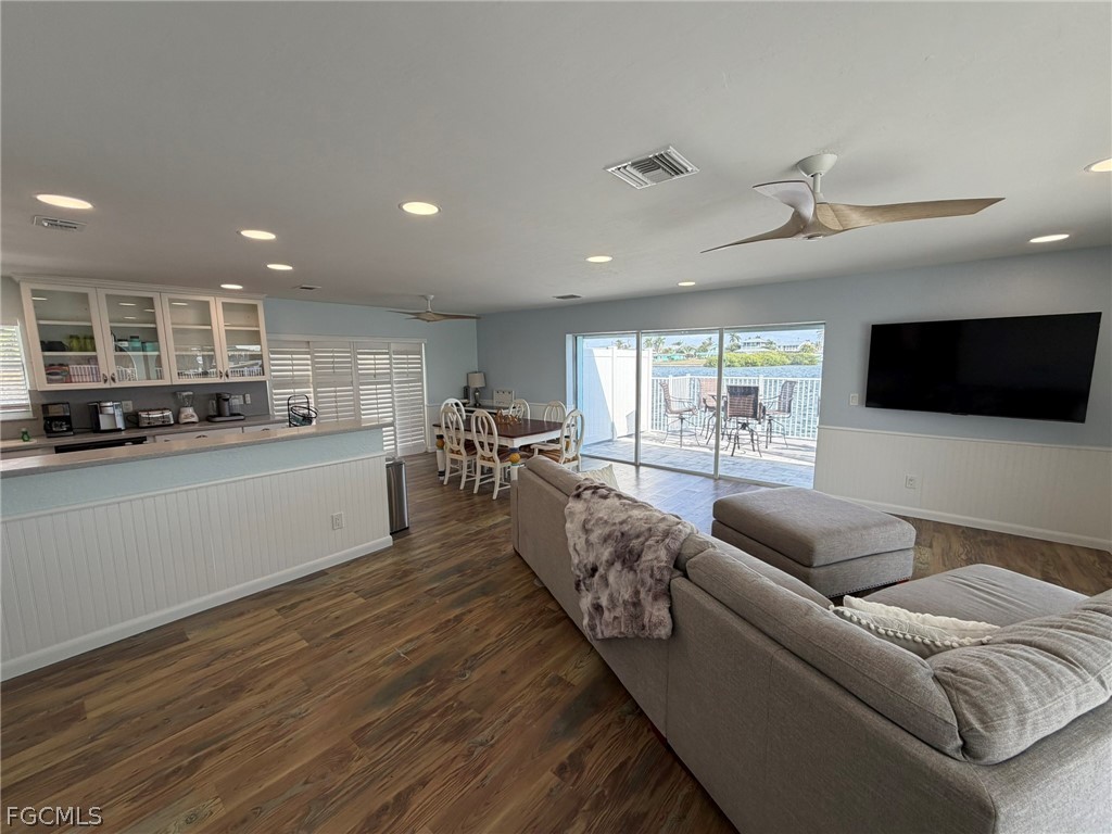4743 Pine Island Road Matlacha, FL 33993 - Photo 16 of 34 a living room with furniture and a flat screen tv