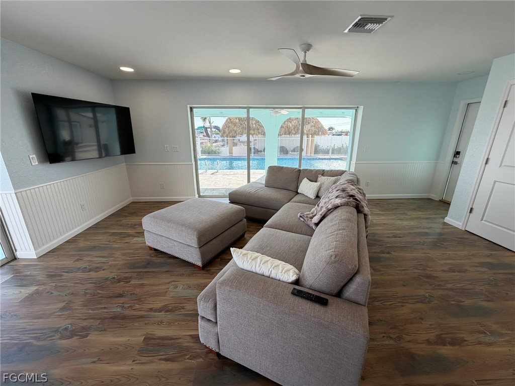 4743 Pine Island Road Matlacha, FL 33993 - Photo 17 of 34 a living room with furniture and a flat screen tv