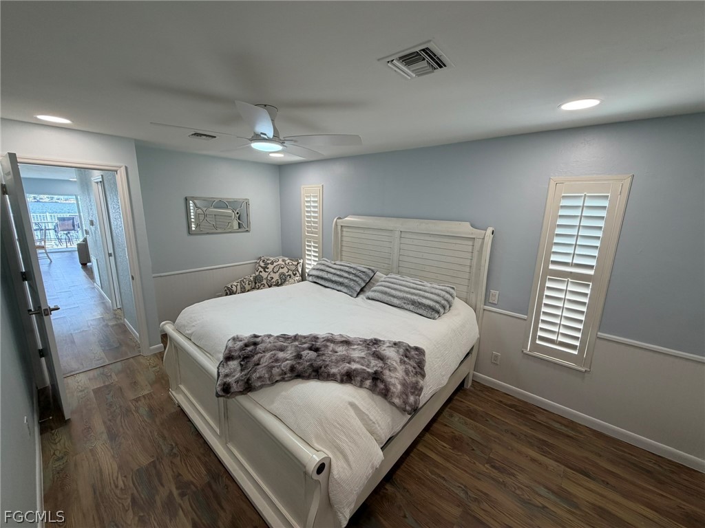 4743 Pine Island Road Matlacha, FL 33993 - Photo 19 of 34 a bedroom with a bed and a window